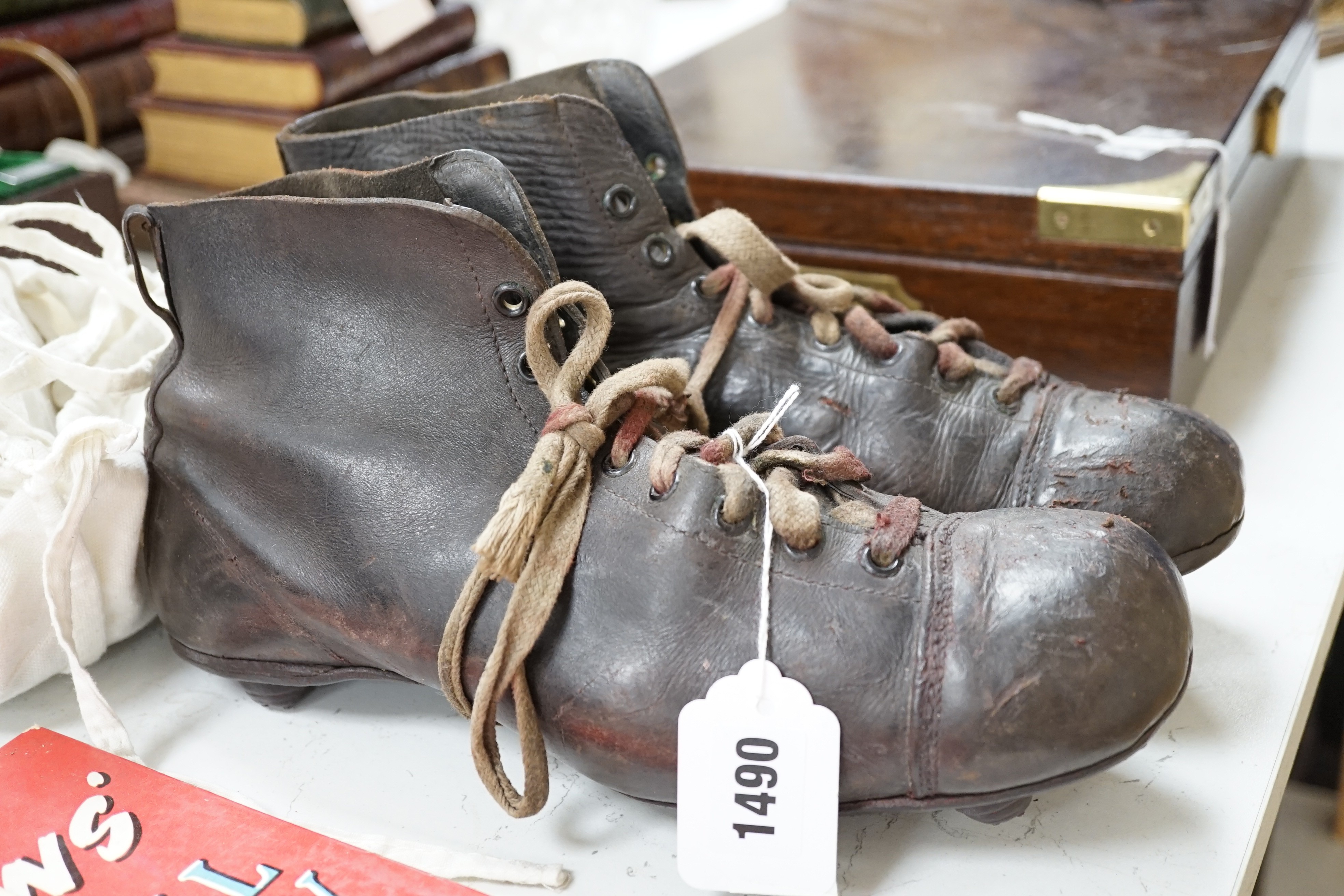 A pair of vintage Football boots and ephemera